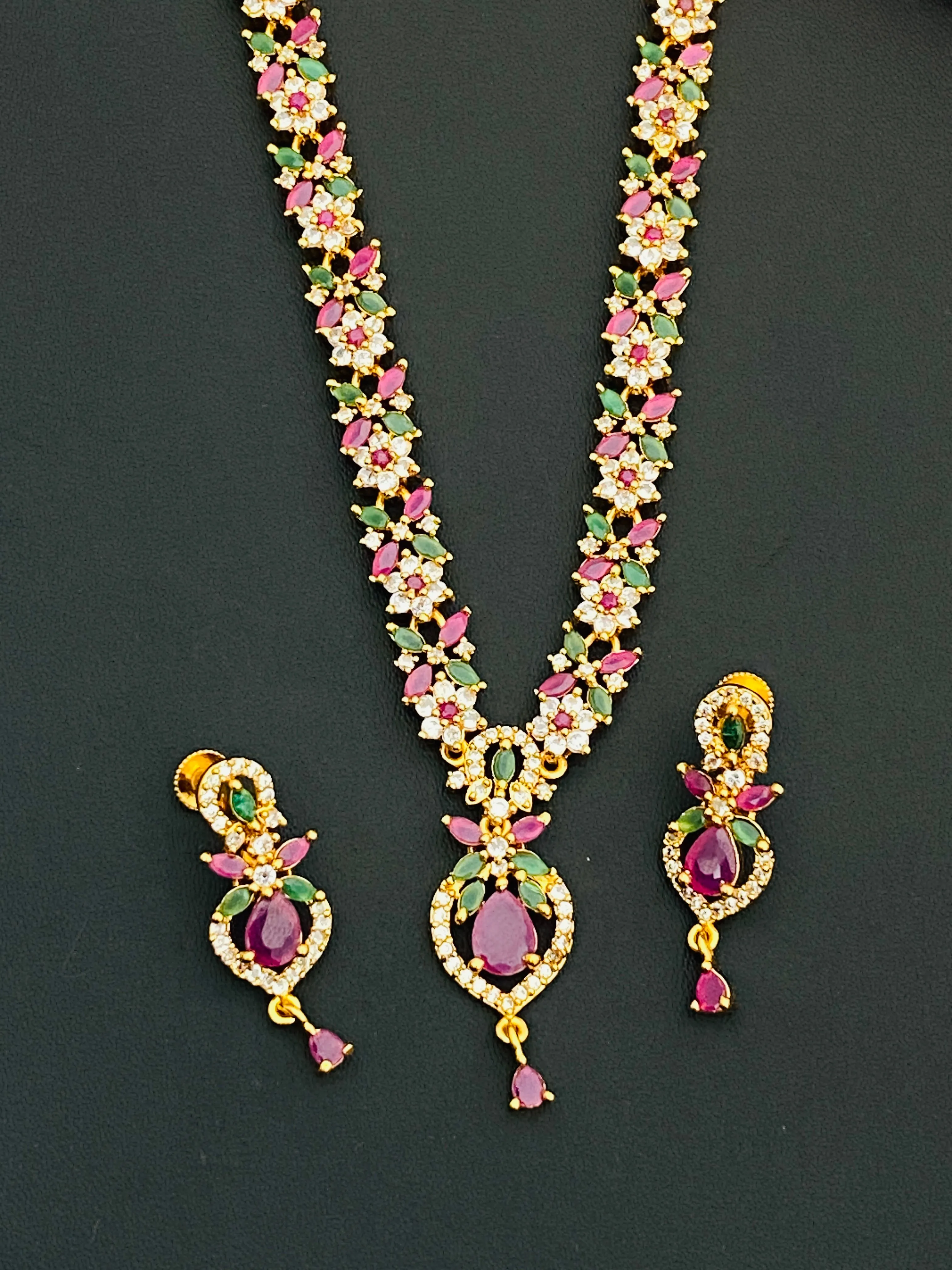 Pretty Gold Plated Multi Color Stoned With Floral Designer Necklace And Earrings