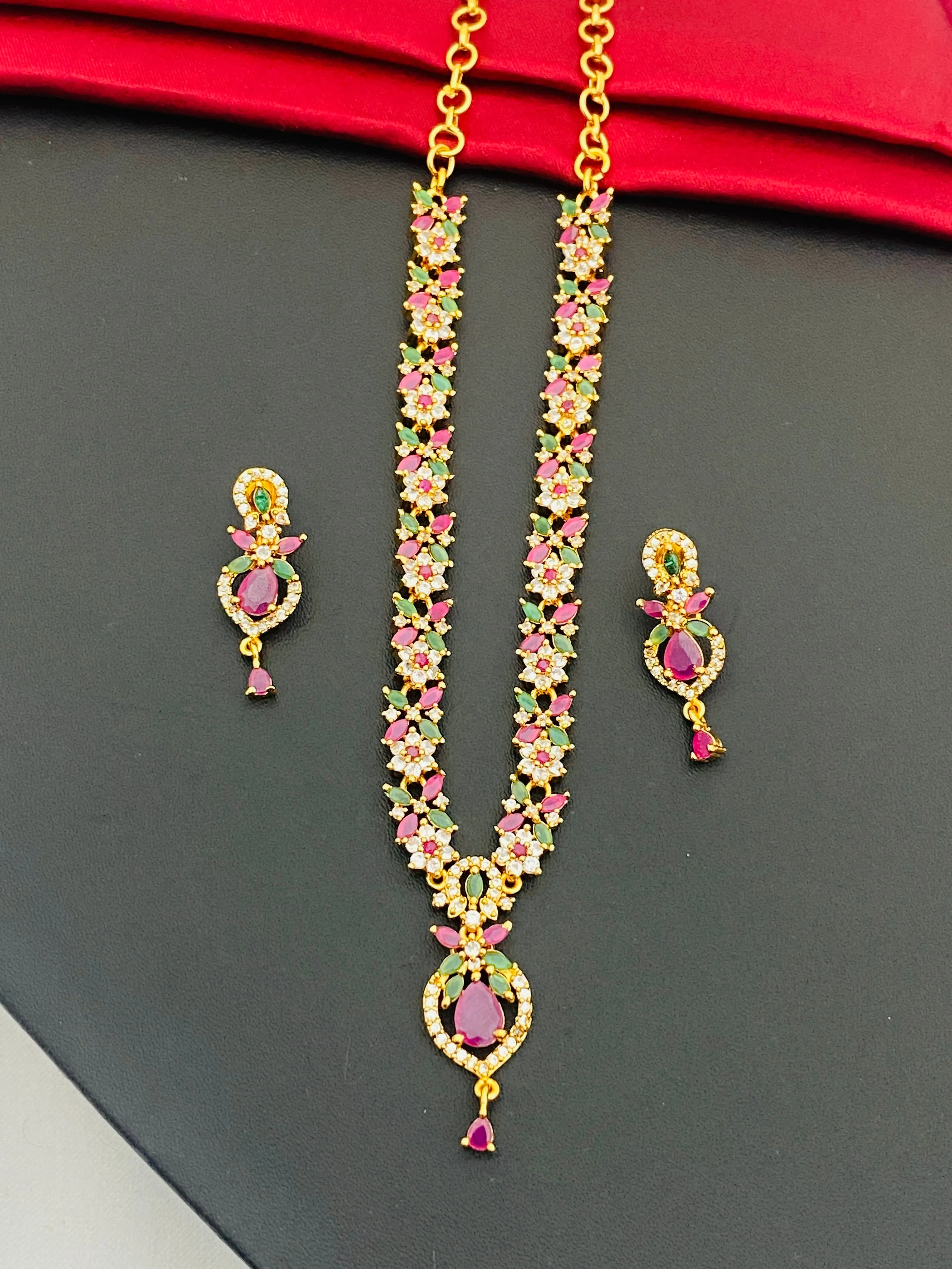 Pretty Gold Plated Multi Color Stoned With Floral Designer Necklace And Earrings