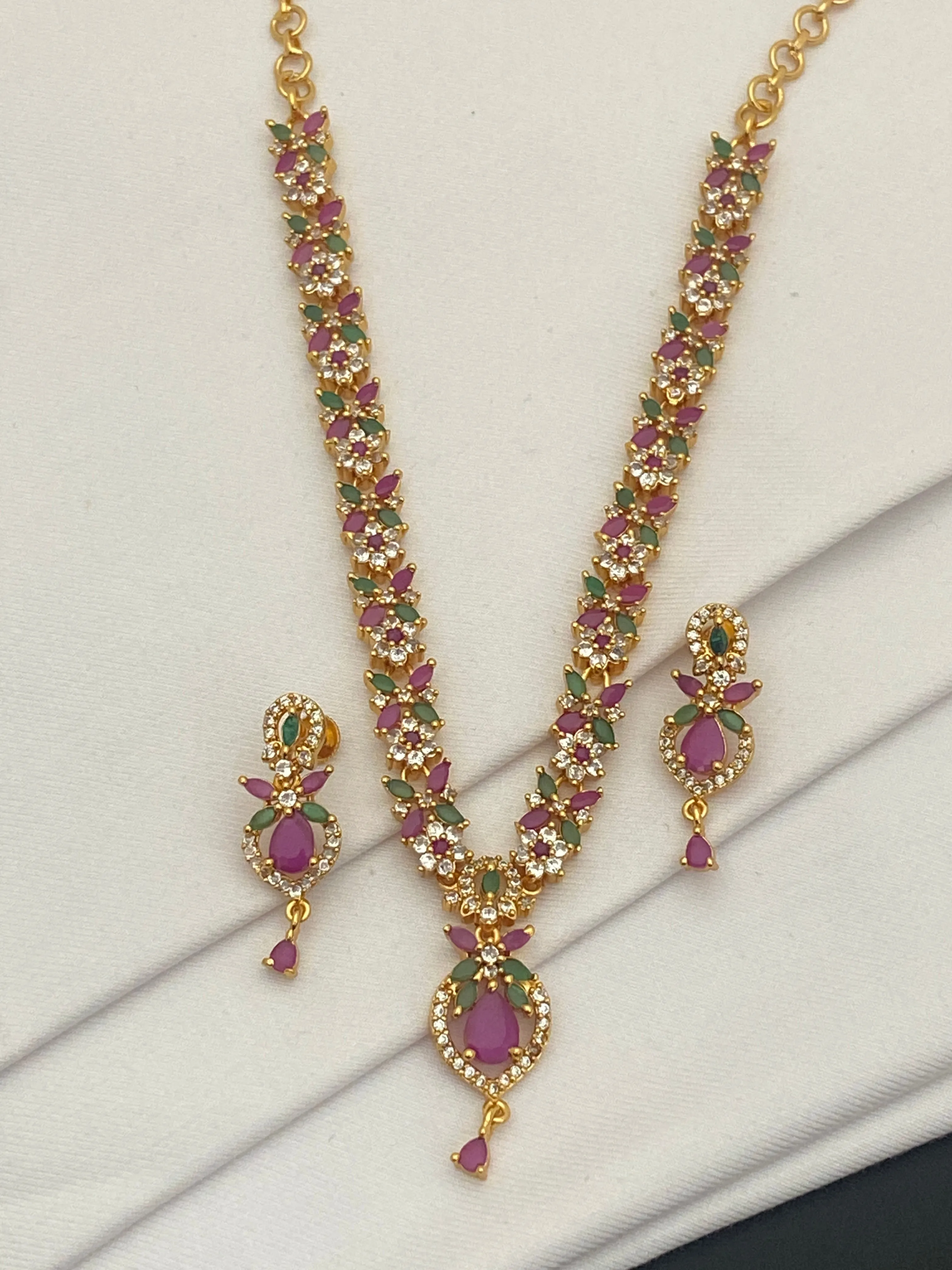Pretty Gold Plated Multi Color Stoned With Floral Designer Necklace And Earrings